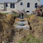 Typical 1000 gal septic tank paired with a typical 500 gallon dose tank for pressurized systems.