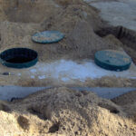 Typical 1000 gal septic tank with risers.