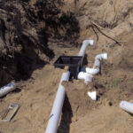 Here we are laying out all the pipe and installing the D box while establishing the correct grades.
