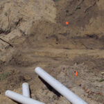 We are starting the excavation of a gravity bed drainfield after setting up the D box and manifold area..