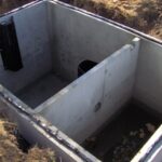 This is a view of a top seam septic tank before the top is installed. Top seam tanks are more expensive but prevent the chance of future leaks dramatically. Notice the different kind of baffle.