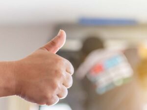a repairman giving the thumbs up