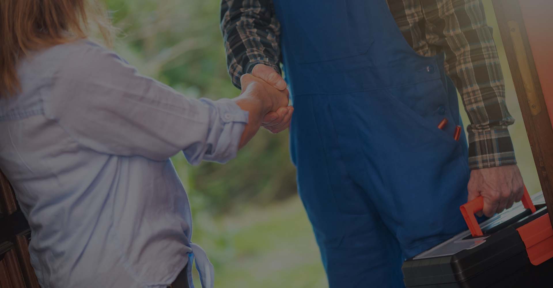 a repairman shaking the hand of a customer