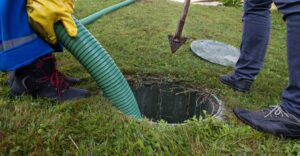 An image of a hose going into a septic system.